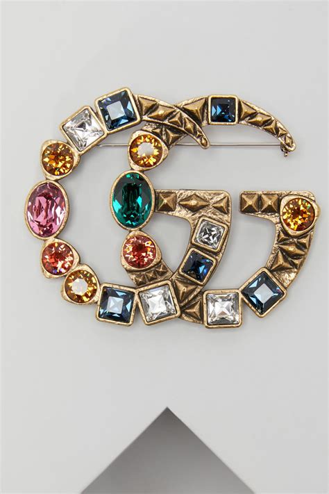 gucci ladies brooches.